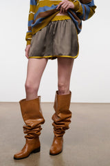 Dark gray side-view shorts with yellow trim and elastic waistband