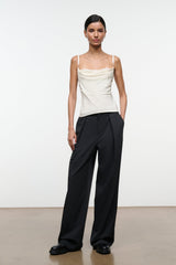 Ivory silk camisole top with draped neckline and thin spaghetti straps