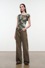 Side view of sleeveless printed top with green-gold butterfly motif and scoop neckline