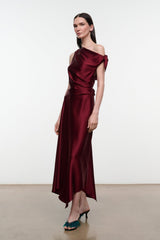 Deep burgundy silk midi dress with draped neckline and asymmetrical tie detail