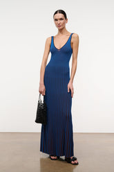 Sleeveless V-neck maxi dress in cobalt blue with vertical dark stripes, side view