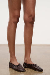 Espresso-brown flat shoe with gathered upper and lace-up detail