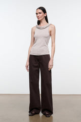 Front view of women's champagne sleeveless tank top with draped cowl neckline