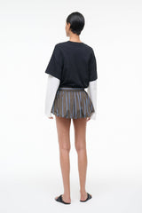 Back view of striped pleated drawstring skirt with vertical blue and gray stripes