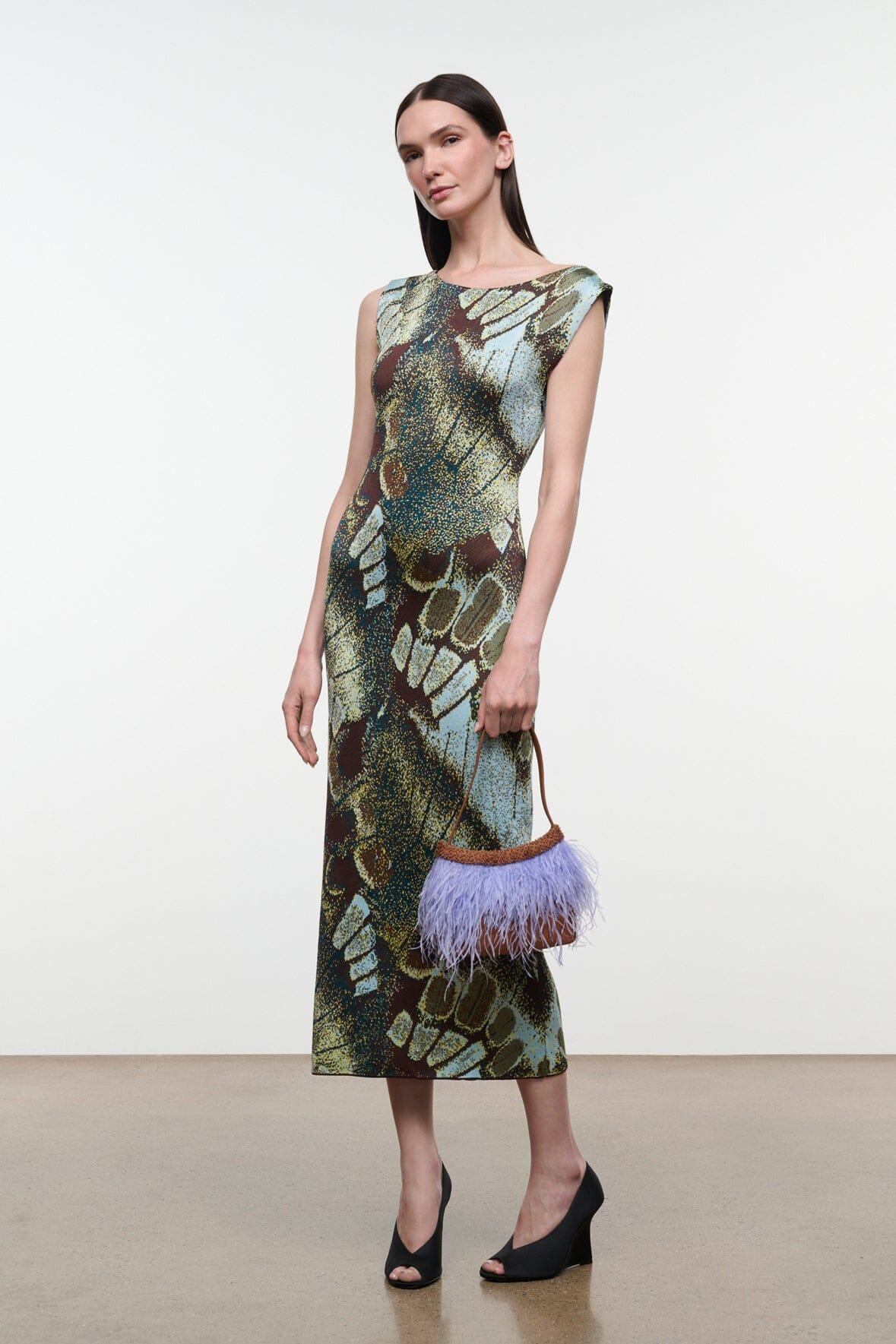 Side view sleeveless midi sheath dress with green and brown butterfly-moss print
