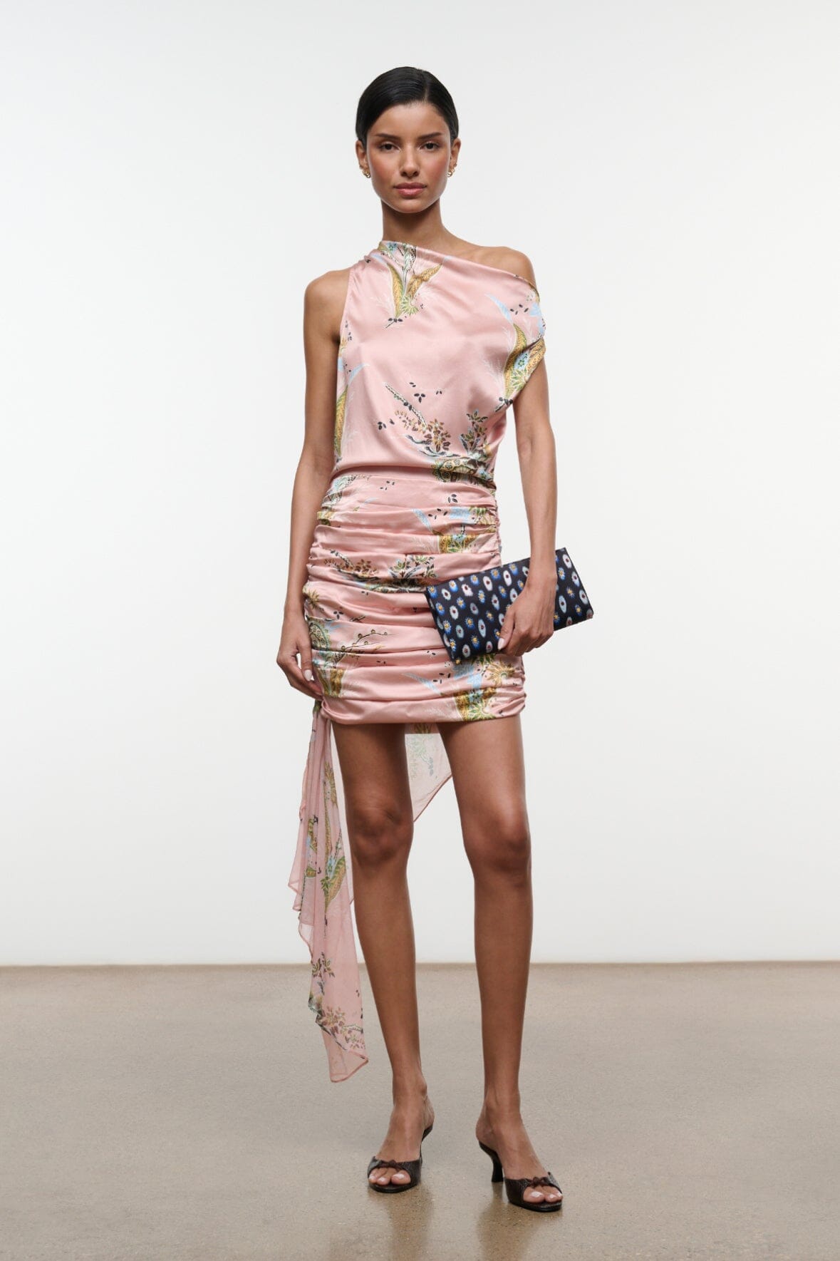 Pink one-shoulder silk mini dress with tapestry floral print and long sheer side drape