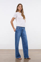 White crew neck T-shirt on model, short sleeves, straight hem