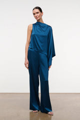 Blue draped silk top with high cowl neckline, sleeveless cut and flowy drape