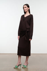 Dark oak knit sweater dress with V-neck and long sleeves, side view, waist tie