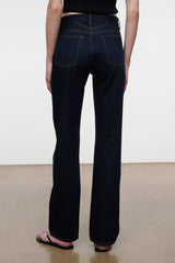 Indigo straight jeans with back pockets, yoke seam, and contrast topstitching