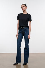 Dark indigo flare jeans with belt loops, button-zip front, and straight-to-flare legs