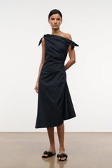 Black one-shoulder midi dress with tied shoulder bow and fitted waist