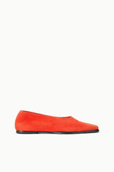 Orange suede flat slip-on shoes with black rubber sole