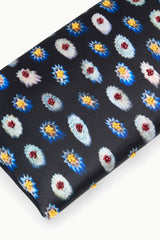 Navy fabric clutch close-up with multicolor rosette floral print
