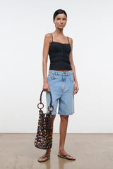 Del Mar bucket bag in multicolor beaded lattice with round ring handles and black trim