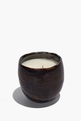 Dark ceramic candle with cream wax and small wick