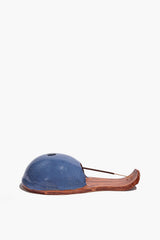 Ceramic incense holder with blue dome, burnt orange tray, and incense stick