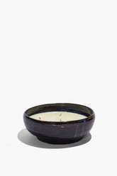 Large ceramic candle bowl with off-white wax top and dark glazed rim
