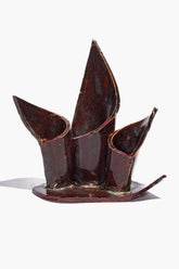 Ceramic triple candleholder with maroon wash glaze, three curved cup holders on base