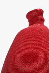 Tall red hand-beaded vase, close-up of beaded neck and shoulder texture