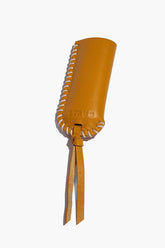 Goldenrod leather lighter cover with stitched rim and two hanging tassel ties.