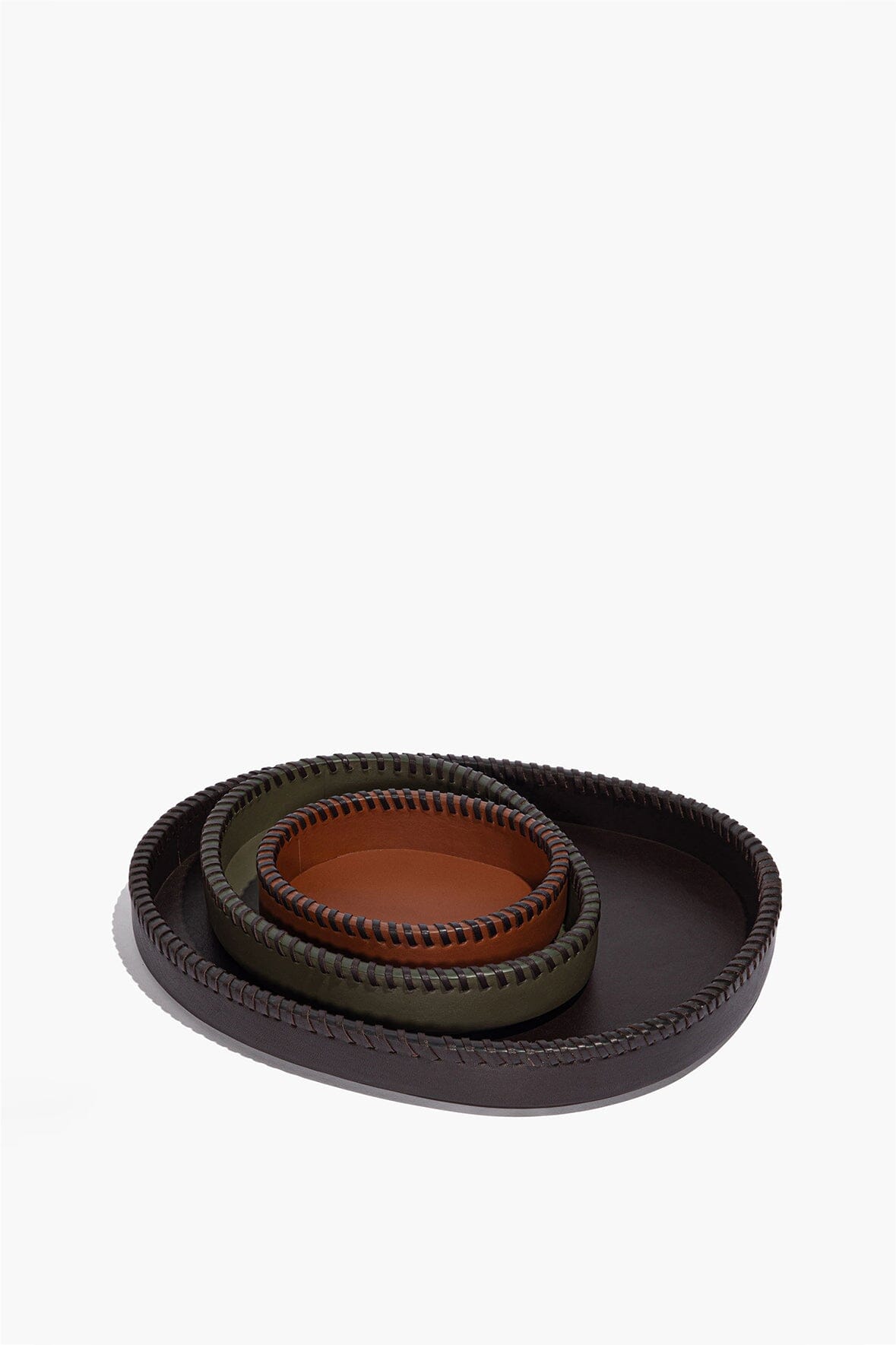 Two nested round leather trays in dark moss tan with contrast-stitched rims