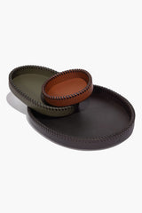 Set of two leather trays with contrast orange-brown and moss green stitching