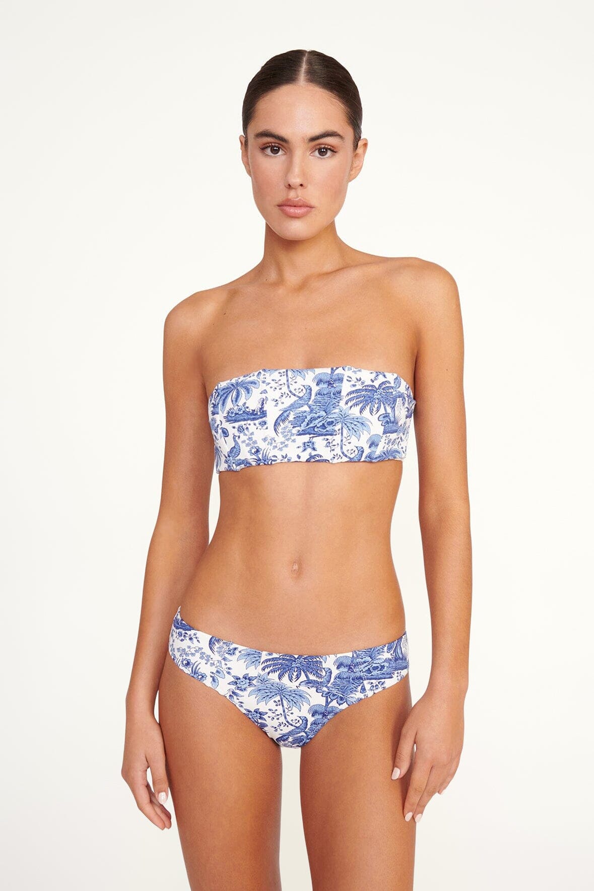 Blue toile bandeau bikini top with strapless neckline and allover tropical print