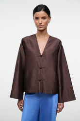 Dark brown silk dupioni top with V-neck and three toggle buttons, cropped silhouette
