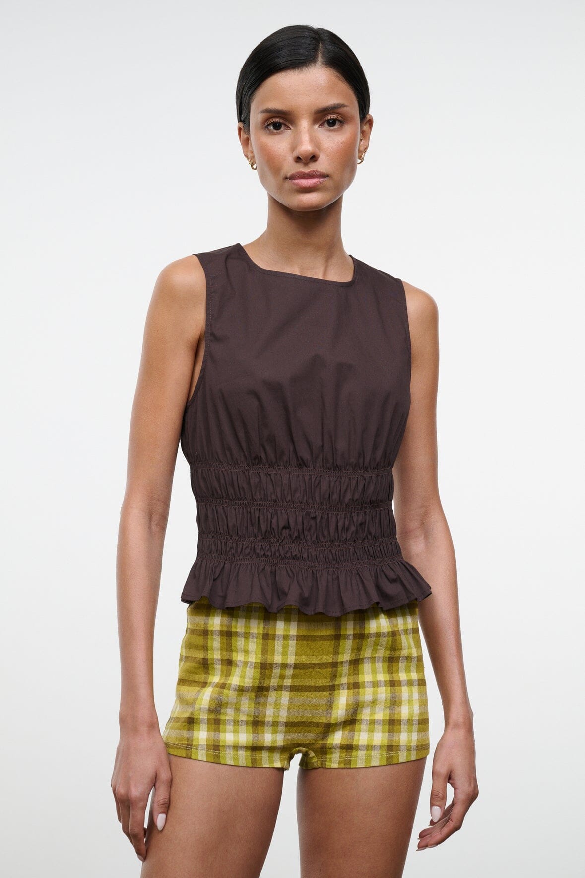 Brown sleeveless top with round neck and ruched peplum hem