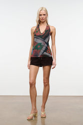 Sleeveless beaded V-neck top with dark floral motifs, sheer fabric and multicolor beads