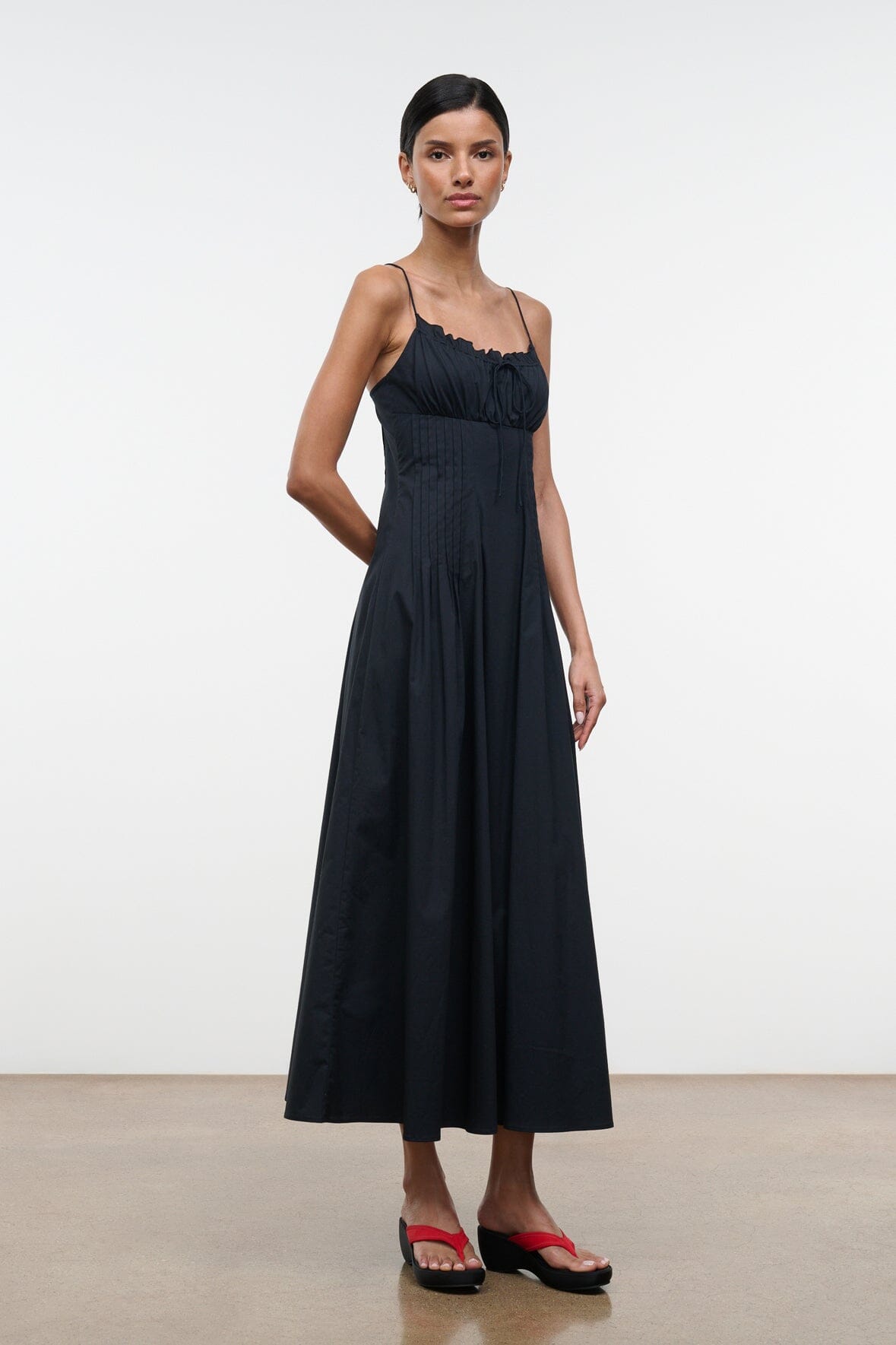Black midi dress with spaghetti straps, gathered bust, full skirt