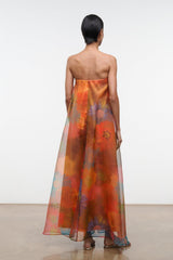 Back view of strapless maxi dress with abstract orange and teal floral print