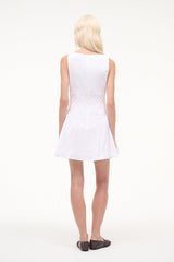 White sleeveless mini dress, back view, fitted waist and flared hem