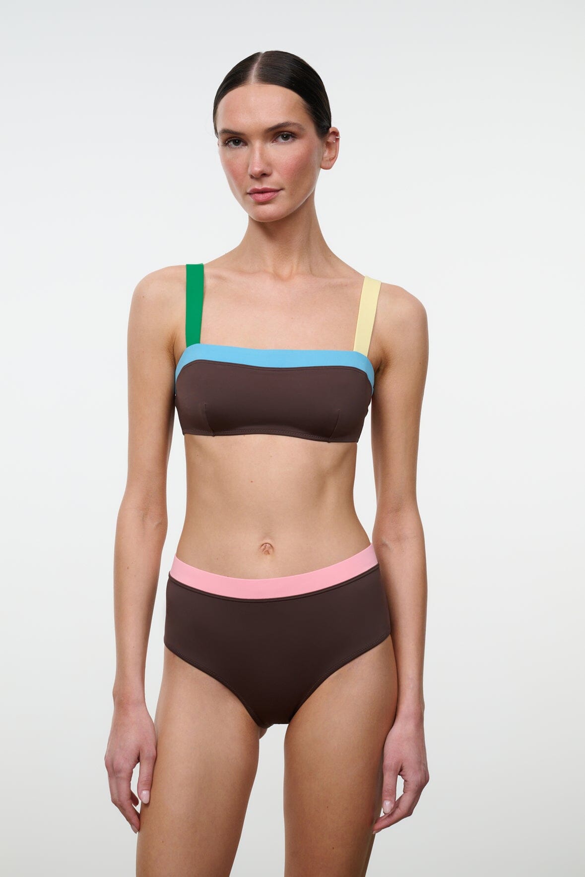 High-rise bikini bottom in dark brown with pink waistband and teal/yellow trim at edges