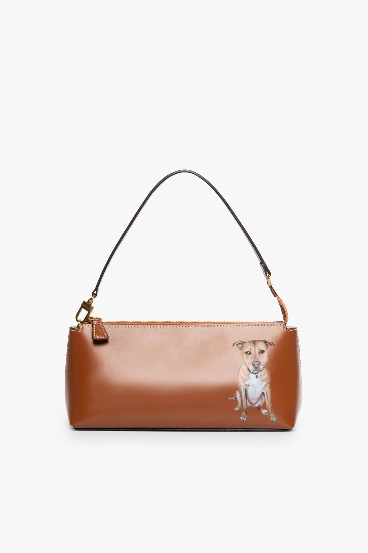 Tan handbag with illustrated dog on front, top handles and gold-tone zipper trim