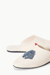 Cream slide slippers with blue graphic and black rubber sole