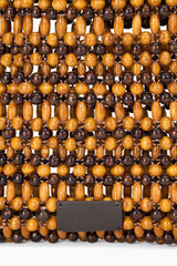 Close-up of multi wood bead woven mini tote with rectangular clasp