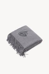 Grey cashmere blanket with fringed edge and embroidered crest