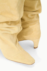 Butter slouch boot close-up of ruched shaft and low stacked heel