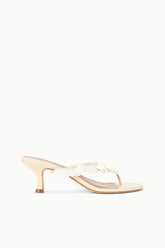 Cream heeled mule sandal with white flower-like strap embellishments