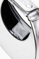 Silver bag interior with stitched card pocket and stamped label