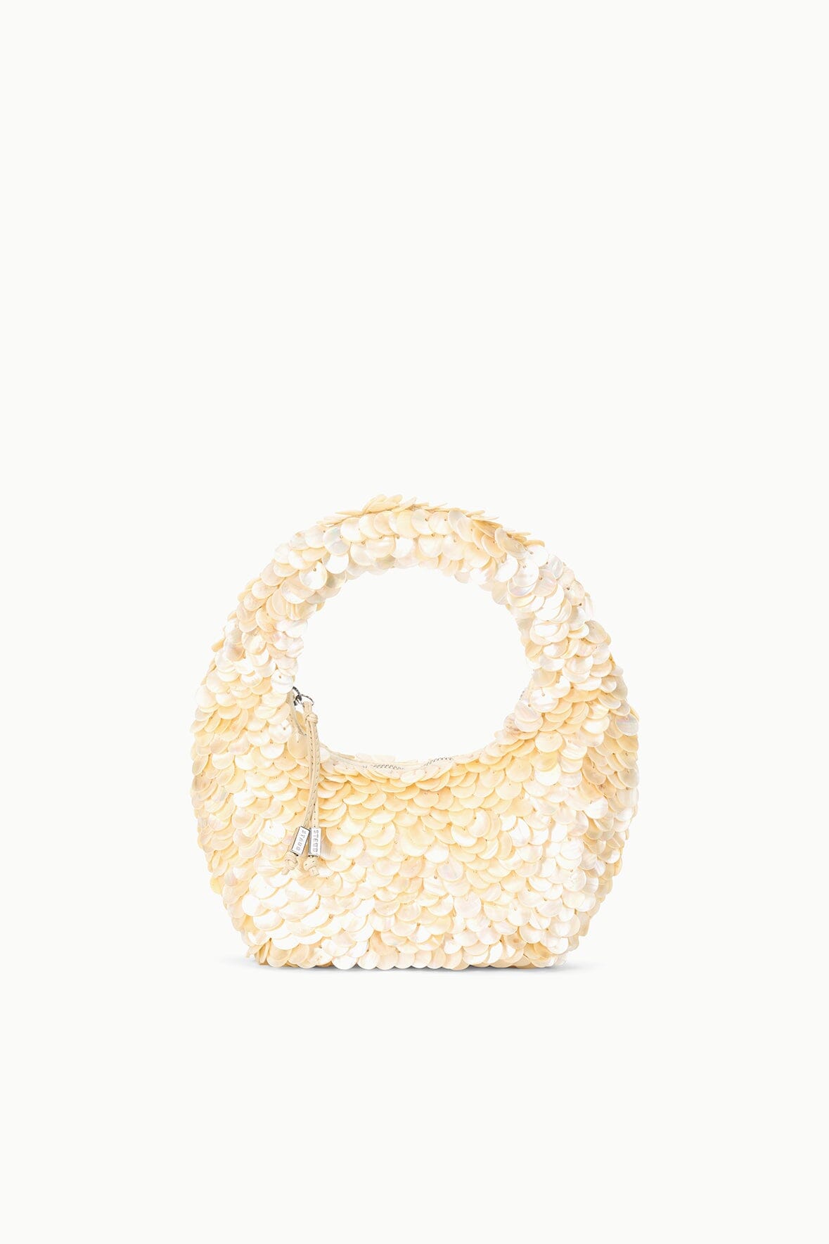 Cream sequined tote bag with rounded handle and scallop texture, front view.