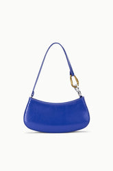 Cobalt blue textured hobo handbag with curved silhouette and gold hardware