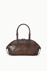 Espresso distressed shoulder bag with top zip, curved handles, and adjustable straps