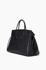 Black carryall handbag with top handle and side tie details on sides