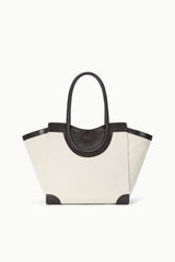 Two-tone tote bag with cream canvas body and dark leather handles