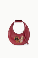 Maroon mini moon bag with custom pet photo patch featuring two dogs