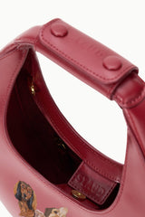 Maroon mini moon bag interior with custom pet photo panel and gold hardware