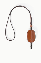 Tan-brown leather whistle pouch on cord with metal whistle tip